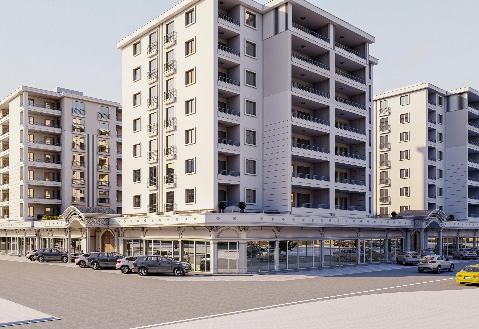 Ansamblu de blocuri alb-gri cu arcada comerciala arcuita la parter si balcoane