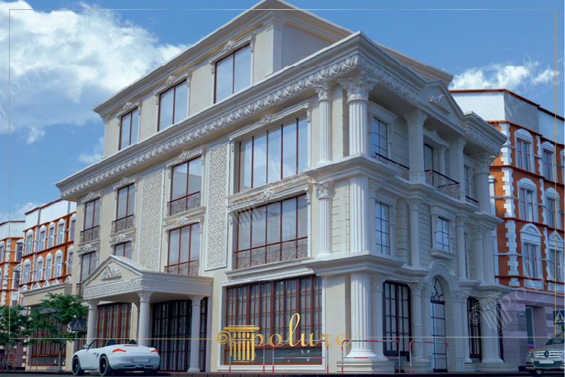Fațadă de clădire de colț cu coloane și fronton clasic