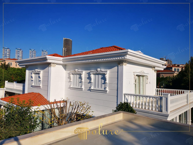 Exterior Facades with Classical Architectural Magnificence Enriched by Polyurethane Columns and Details The elegance of classical architecture is also evident in modern buildings. The villa in this picture displays one of the most beautiful examples of classical exterior decoration. The nobility of white meets polyurethane columns and Corinthian style column capitals. While window jambs add depth to the elegant details on the exterior facades, badastrol and eaves moldings make the characteristic silhouette of the building clear. Polyurethane panel coverings It brings long-lasting beauty to exterior facades by blending traditional aesthetics with the advantages of modern materials. Whether you are designing a new building or thinking of adding a classic touch to an existing house, these elements add originality and aesthetic value to every project.